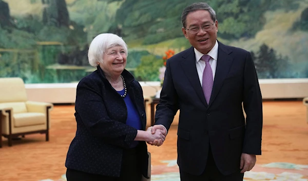 US Treasury Secretary Janet Yellen shakes hands with Chinese Premier Li Qiang at the Great Hall of the People in Beijing on April 7, 2024, as Yellen begins two days of high-level talks in Beijing. (AFP)