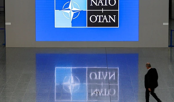 A man walks in the lobby of the NATO headquarters, Wednesday, Nov. 16, 2022 in Brussels. (AP)