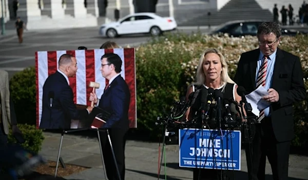 Marjorie Taylor Greene (2nd R) and Thomas Massie (R) hold a press conference outside the US Capitol. (AFP via Getty Images)