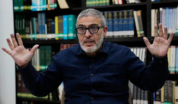 Dr. Ghassan Abu Sitta, a Palestinian-British surgeon specializing in conflict medicine, speaks during an interview at the Institute for Palestine Studies in Beirut, Lebanon, Saturday, Dec. 9, 2023. (AP)