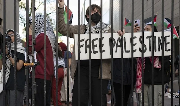 Palestinian supporters and students protest outside Columbia University on April 20 against Israeli genocide in Gaza. (AP)