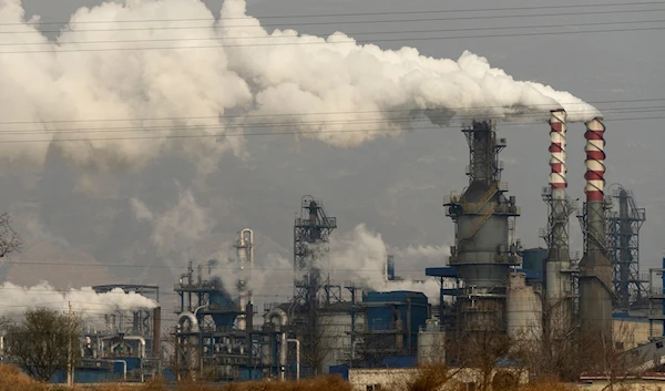 Smoke and steam rise from a coal processing plant in Hejin in central China's Shanxi Province on Nov. 28, 2019. (AP)