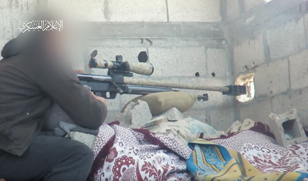 A screenshot from a video posted by Al-Qassam Brigades on Telegram during a sniping operation in Al-Zaytoun Neighborhood in Gaza on May 10, 2024. (Al-Qassam Brigades Military Media)