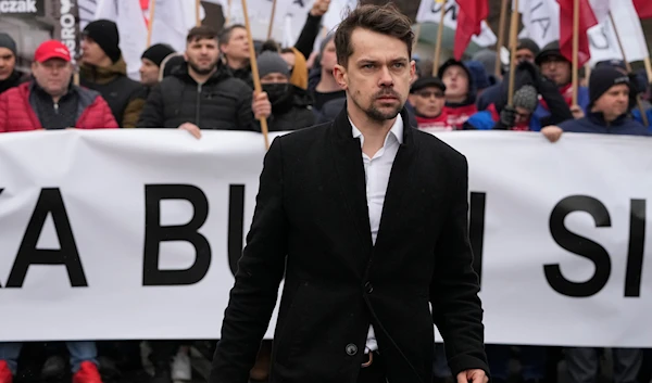 Leader of the Polish conservative agrarianism political movement Agrounia Michal Kolodziejczak, front, takes part in a protest against gas and fertilizer price hikes, in Warsaw, Poland, on February 23, 2022. (AP)