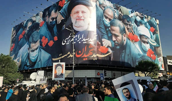 Mourning Iranian President Ebrahim Raisi in Tehran on Wednesday. (AFP via Getty Images)