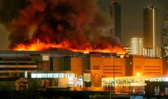 A massive blaze is seen over the Crocus City Hall on 22 March. (AP)