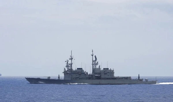 This undated handout photo released by the Taiwan Defense Ministry on September 13, 2023 shows Chinese aircraft carrier Shandong (L) while being monitored by a Taiwanese Keelung class warship at sea. (Ministry of Defense in Taiwan via AFP)