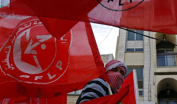 Palestinian youth participates in a rally marking the 42nd anniversary of the leftist Popular Front for the Liberation of Palestine (PFLP), Nablus, West Bank, Palestine, Dec. 19, 2009. (AP)