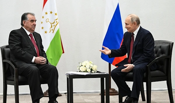 Russian President Vladimir Putin, right, gestures as he speaks to Tajikistan President Emomali Rahmon during their talks in Kazan the capital of Republic of Tatarstan, Russia, Wednesday, Feb. 21, 2024. (AP)