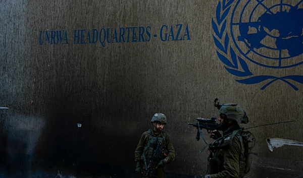 Israeli soldiers take up position as they enter the UNRWA headquarters, February 8, 2024, Gaza, occupied Palestine (AP)