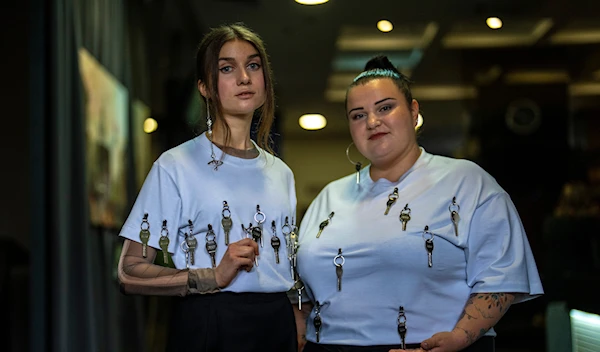 Ukrainian singer Jerry Heil, left, and rapper alyona alyona pose for a photograph during an interview with The Associated Press in Ukraine, Thursday, April 25, 2024. (AP)