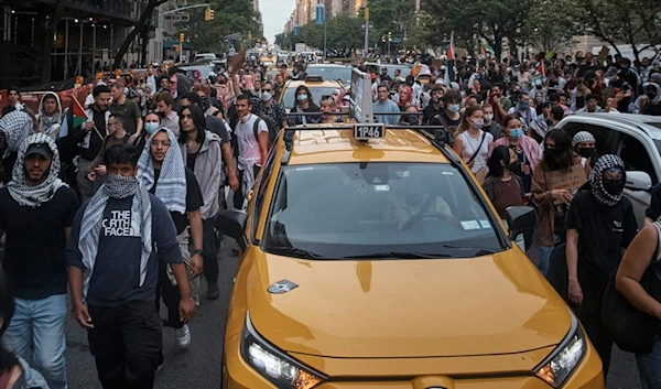 Pro-Palestinian protesters march in between traffic near the Metropolitan Museum of Art, where the Met Gala takes place, Monday, May 6, 2024, in New York. (AP)