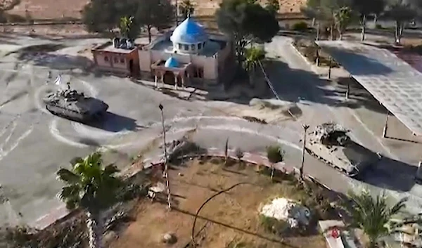 In this image grab from video released by the army, Israeli tanks are seen entering the Palestinian side of the Rafah border crossing between Egypt and Gaza, the main entry point for aid deliveries to the besieged territory © AFP