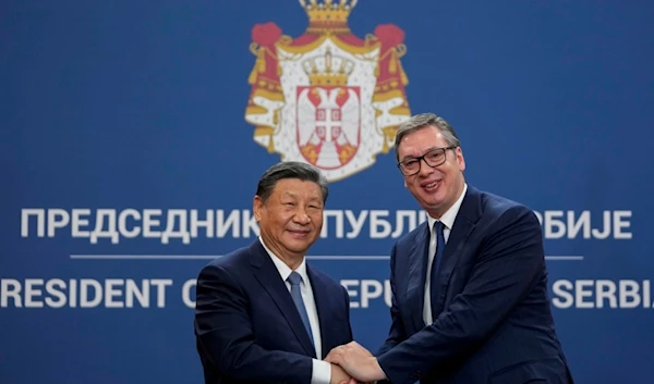 Chinese President Xi Jinping shakes hands with Serbian President Aleksandar Vucic at the Serbia Palace in Belgrade, Serbia, Wednesday, May 8, 2024. (AP Photo/Darko Vojinovic)