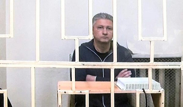 Russian Deputy Defense Minister Timur Ivanov sits behind bars in a video link provided by the Russian Federal Penitentiary Service at the Moscow City Court, in Moscow, Russia, on Wednesday, May 8, 2024 (AP)