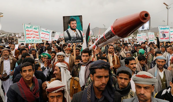 Yemenis attend a rally against the US-led strikes against Yemen and in support of Palestinians in the Gaza Strip, in Sanaa, Yemen, April 26, 2024 (AP)