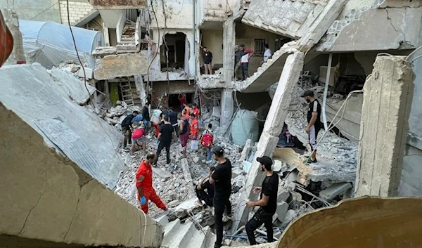 Rescue teams assess the damage following an Israeli airstrike on the Ain al-Helweh camp in Saida- October 1, 2024 (AFP).