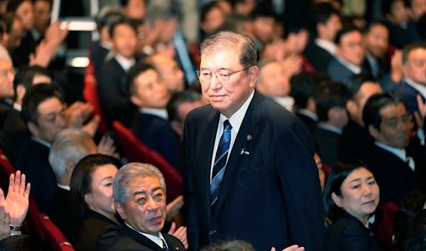 Shigeru Ishiba, center, acknowleges after he was elected as new head of Japan's ruling Liberal Democractic Party (LDP) during the party's leadership election on September 27,2024, in Tokyo.   (AP)