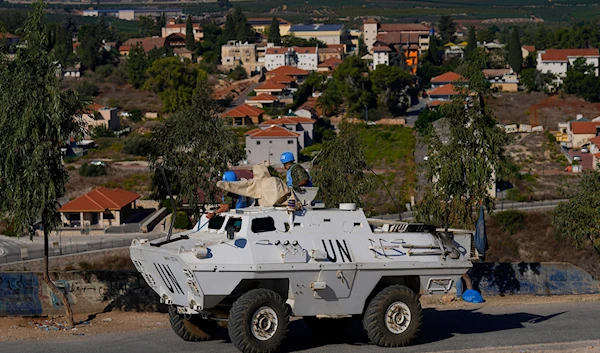 U.N. peacekeepers patrol on the Lebanese side of the Lebanese-Israeli border in the southern village of Kfar Kila, with the Israeli town of Metula in the background, Lebanon, Friday, Oct. 13, 2023. (AP)