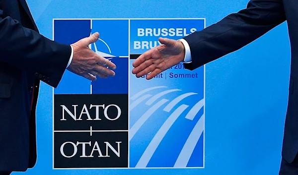 U.S. President Donald Trump, left, is greeted by NATO Secretary General Jens Stoltenberg before a summit of heads of state and government at NATO headquarters in Brussels on Wednesday, July 11, 2018 (AP)