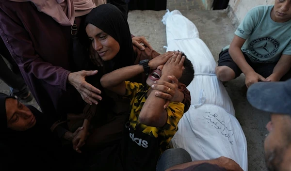 Mourners attend the funeral of Palestinians killed in the Israeli bombardment of the Gaza Strip outside the hospital morgue in Deir al-Balah on Wednesday, Oct. 9, 2024. (AP)