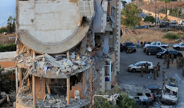 Lebanese army soldiers deploy around a destroyed building hit by an Israeli airstrike, in Barja, south of Beirut, Lebanon, Saturday, Oct. 12, 2024 (AP)