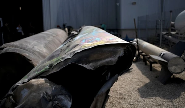 Iranian ballistic missile components that were fired at Israeli targets are displayed during a govermenet organized media tour on a base in southern occupied Palestine, Wednesday, October 9, 2024. (AP)