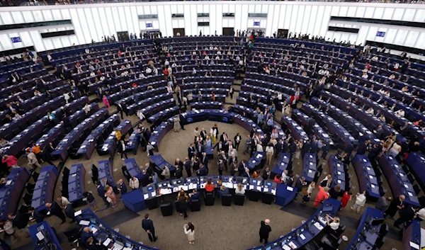 Members of European Parliament enter the plenary chamber as they prepare to vote at the European Parliament in Strasbourg, eastern France, Thursday, July 18, 2024.