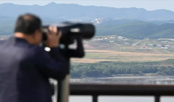 A man uses binoculars to look at the DPRK side of the Demilitarised Zone from South Korea's Odusan Unification Observatory in Paju. (AFP)