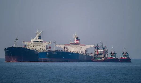 The Liberian-flagged oil tanker Ice Energy (L) transfers crude oil from the Russian-flagged oil tanker Lana (R), off the shore of Karystos, on the Island of Evia, on May 29, 2022. (AFP via Getty Images)