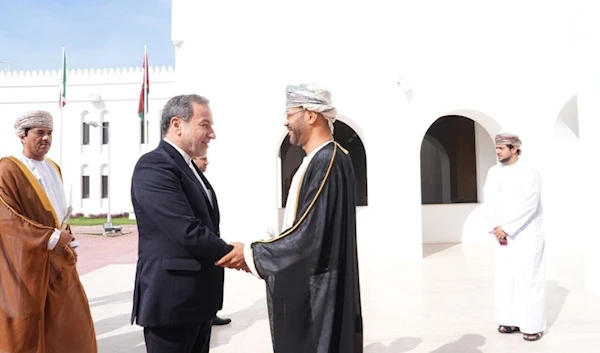 Omani Foreign Minister Badr bin Hamad Al Busaidi receives his Iranian counterpart Abbas Araqchi in Muscat (IRNA).