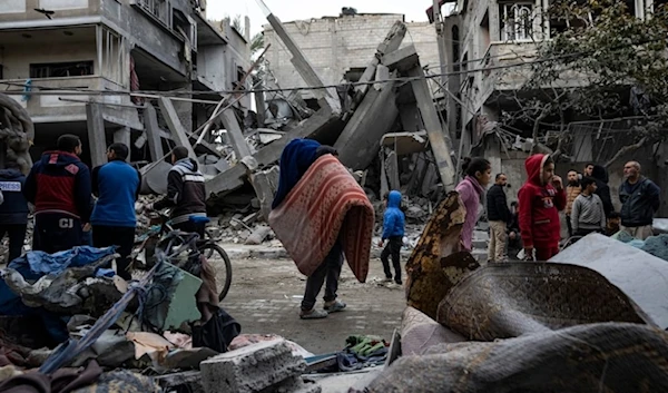 Palestinians inspect the damage of resdiential buildings after an Israeli occupation airstrike in Rafah, southern Gaza Strip, occupied Palestine, Sunday, March 24,2024. (AP)