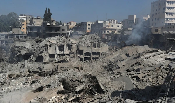 Destroyed shops and buildings at commercial street that hit Saturday night by Israeli airstrikes, in Nabatiyeh town, south Lebanon, Sunday, October 13, 2024 (AP)