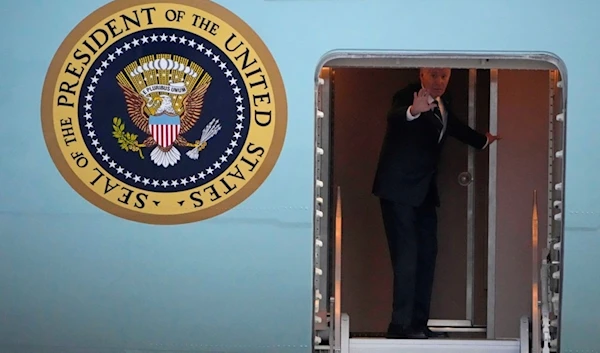 U.S. President Joe Biden waves as he boards Air Force One for departure at Brandenburg Airport in Schoenefeld near Berlin, Germany, Friday, Oct. 18, 2024. (AP)