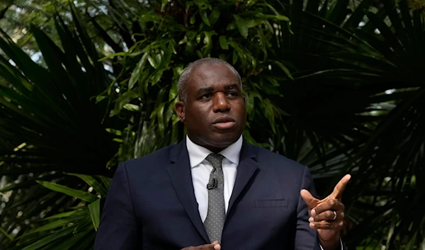 Britain's Foreign Secretary David Lammy gestures while speaking about climate and environment policy at Kew Gardens in London, on September 17, 2024. (AP)