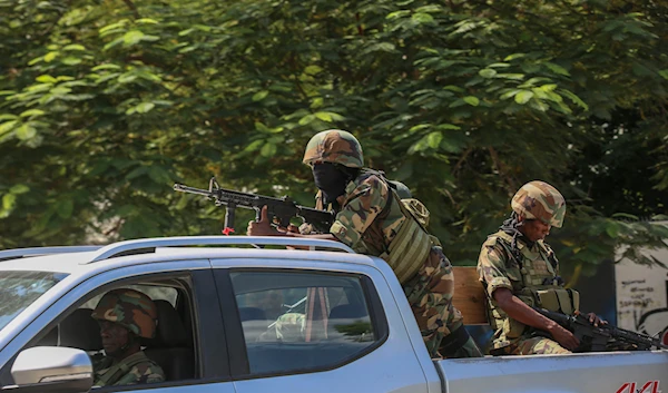 Soldiers patrol amid the sound of gunshots heard in the distance, in Port-au-Prince, Haiti, on October 17, 2024. (AP)