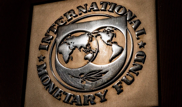 logo of the International Monetary Fund is visible on its building, in Washington on April 5, 2021. (AP)