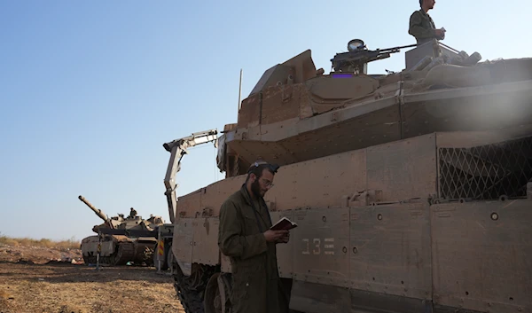 Israeli soldiers at a staging area in northern occupied Palestine on October 6, 2024. (AP)