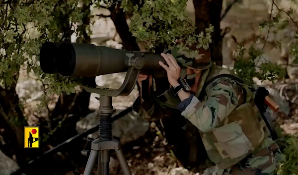 A Hezbollah fighter monitors Israeli movements in an undisclosed location, possibly in southern Lebanon (Undated/Islamic Resistance in Lebanon Military Media)