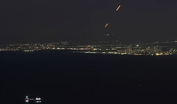 Israeli Iron Dome air defense system fires to intercept rockets that were launched from Lebanon, as seen from Haifa, northern occupied Palestine, on September 26, 2024. (AP)