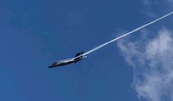 An Israeli air force F-35 war plane flies over occupied al-Quds, May 12, 2024. (AP)