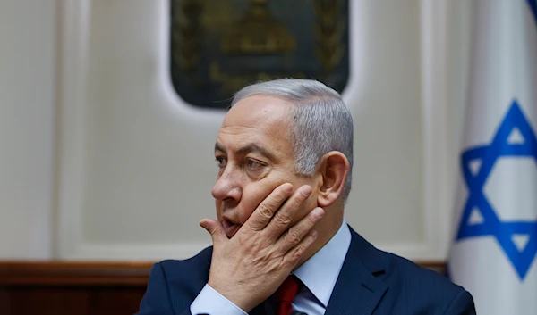 Israeli Prime Minister Benjamin Netanyahu chairs the weekly cabinet meeting at his office in occupied al-Quds, on December 9, 2018. (AP)