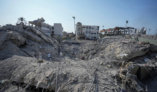 Palestinians inspect the rubble of a school destroyed in an Israeli airstrike on Deir al-Balah, central Gaza Strip, Saturday, July 27, 2024. (AP Photo/Abdel Kareem Hana)