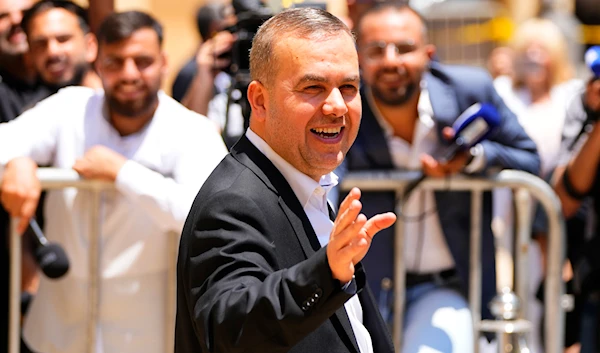 Lebanese lawmaker Hassan Fadlallah leaves the parliament building after he attends a parliament session in Beirut, Lebanon, on June 14, 2023. (AP)