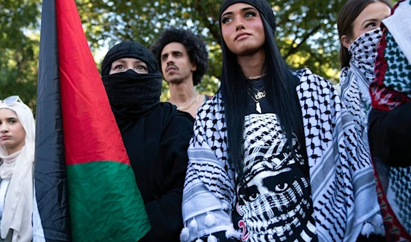 Pro-Palestinian activists protest at Lafayette Park across from the White House to mark the approaching one-year anniversary of the genocide in Gaza, Saturday, October 5, 2024, in Washington (AP)