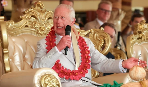 Britain's King Charles III speaks during the bestowing and farewell ceremony on the final day of the royal visit to Samoa at the Siumu Village in Apia, Samoa, Saturday, Oct. 26, 2024. (AP)