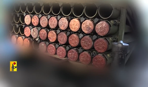 Hezbollah fighters load up rockets to be launched at the settlement of Karmiel in northern occupied Palestine in an undisclosed location southern Lebanon, October 31, 2024 (Islamic Resistance military media)