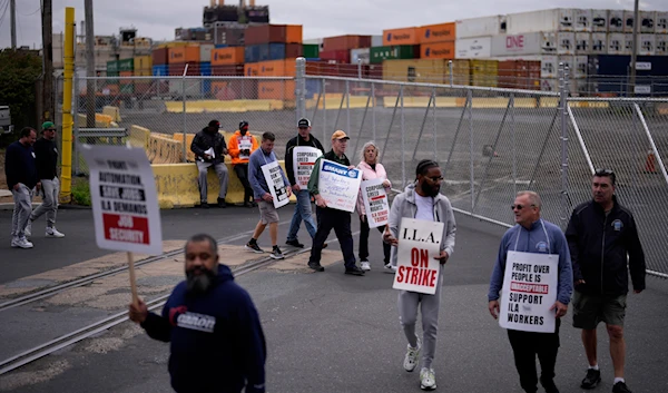 Striking longshoreman picket outside the Packer Avenue Marine Terminal Port, on October 1, 2024, in Philadelphia. (AP)