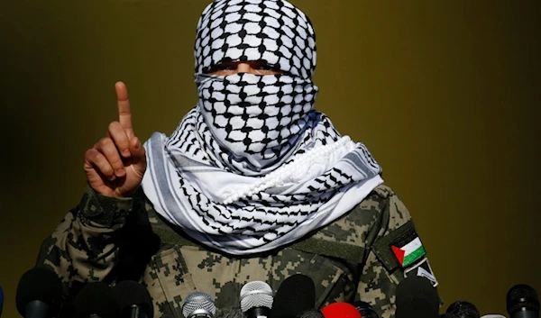 A Palestinian spokesperson for the Palestinian Resistance Joint Operations Room talks during a press conference outside Gaza City, Palestine, on December 29, 2020 (AP)