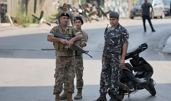 Lebanese security stand guard on a road that leads to the U.S. Embassy in Aukar, a northern suburb of Beirut, Lebanon, Wednesday, June 5, 2024. (AP)